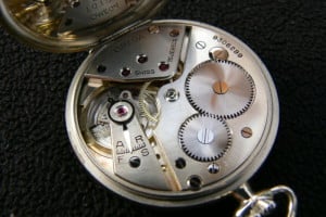 The inside of an Omega pocket watch.